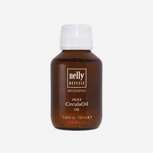 A bottle of therapeutic body oil placed on a soft, natural fabric, highlighting its hydrating and soothing properties, perfect for revitalizing tired and heavy legs.