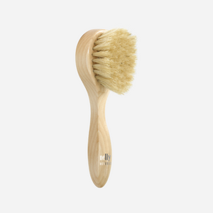 Nelly De Vuyst® Facial Brush with soft boar hair, designed to enhance oxygenation, exfoliation, and product absorption for a radiant complexion.