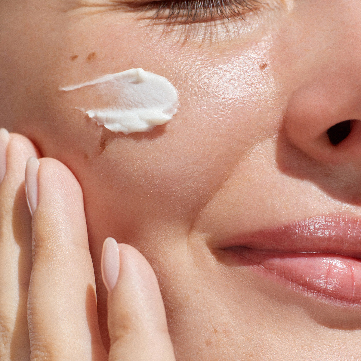 Close-up of the creamy texture of the Radiance Cream, showcasing its smooth and lightweight formula that enhances skin luminosity.